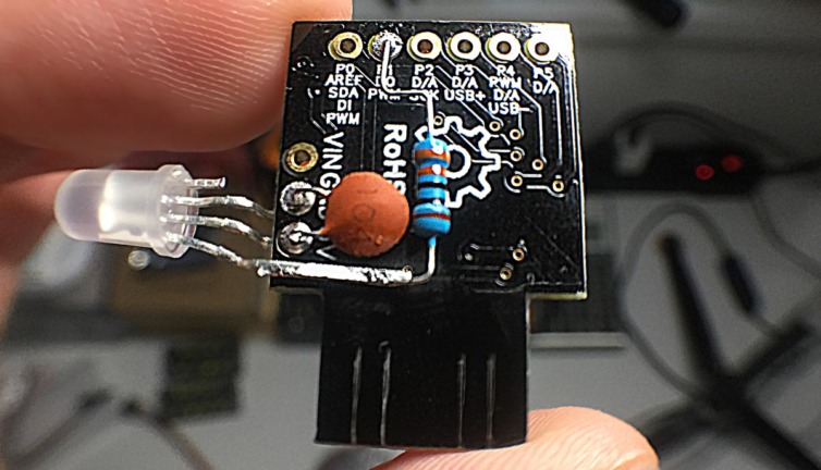 Digispark with APA106 RGB LED, 330 ohm resistor, and small capacitor